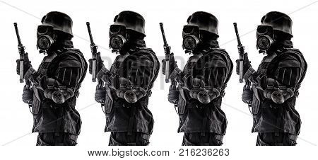 Line of futuristic nazi soldier sentinel gas mask and steel helmet with schmeisser handgun isolated on white studio shot standing to attention profile