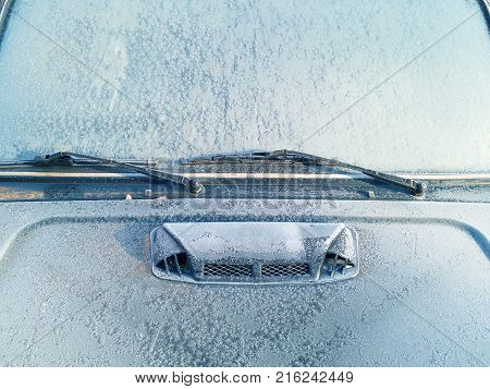 the frozen car covered with ice. windshield close-up