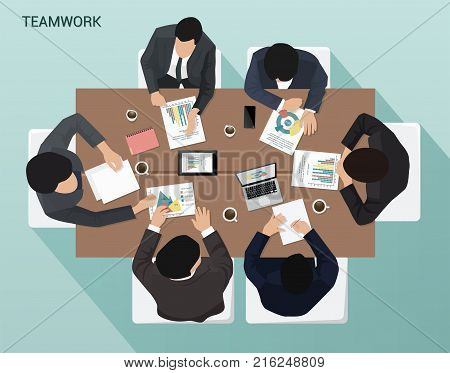 Business meeting of businessmen at an office desk Top view