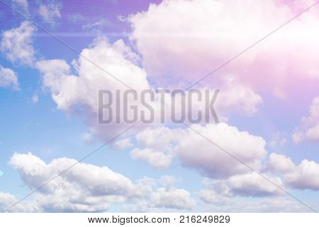 beautiful cumulus clouds against a blue sky at sunrise