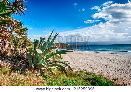 Beach In A Sunny And Cloudy Day