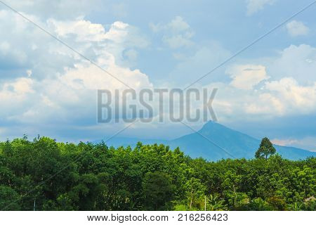 Beautiful view of rural landscape dramatic mountain under cloudy sky concept of nature landscape cloudscape skyscape.