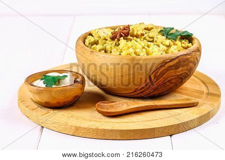 Indian Biryani With Chicken, Yogurt And Spices In A Plate On A Wooden Table. New Year's, Christmas D