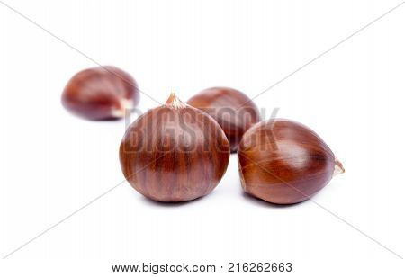Fresh ripe chestnuts isolated on white background