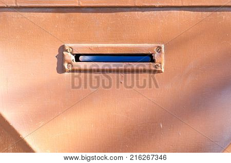 Old letterbox or mailbox in the metal gate door traditional way of delivering letters to the house close up
