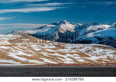 Trail Ridge Road, the highest (12,183 feet) continuous highway in the USA in high alpine tundra with rocks and mountains at autumn. Rocky Mountain National Park in Colorado, USA. 