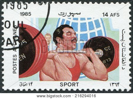 AFGHANISTAN - CIRCA 1985: A stamp printed in the Afghanistan, is shown Weight lifting, circa 1985