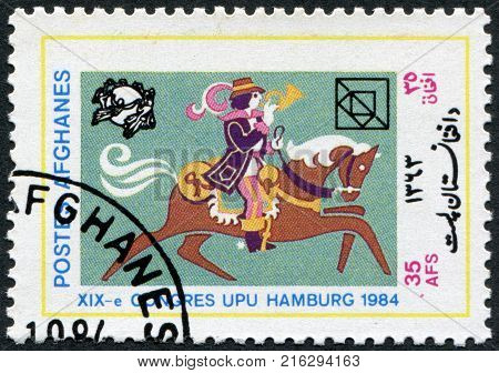 AFGHANISTAN - CIRCA 1984: A stamp printed in the Afghanistan devoted to 19th UPU Congress, Hamburg. Postrider depicted 16th century, circa 1984
