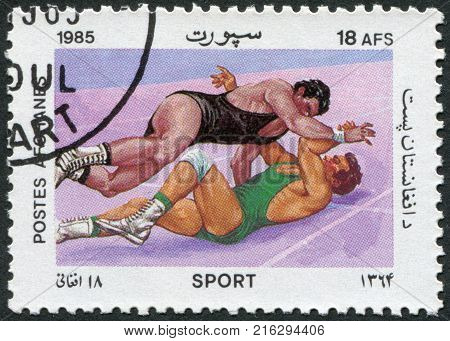 AFGHANISTAN - CIRCA 1985: A stamp printed in the Afghanistan, is shown Wrestling, circa 1985