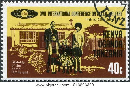 EAST AFRICAN COMMUNITY - CIRCA 1974: A stamp printed in East African Community, dedicated to the International Conference on Social Welfare, shows a family of five persons, circa 1974
