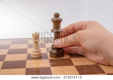 Hand Holding Wooden Domino