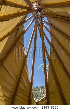 Looking upward at the smoke hole of a tipi