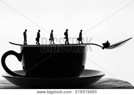 miniature People taking morning coffee before work