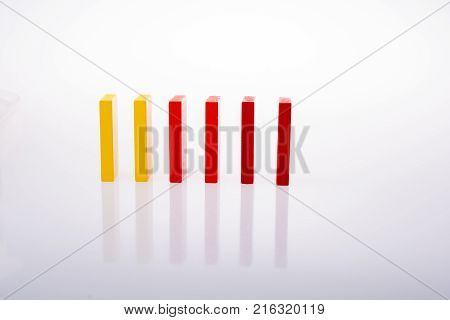 Colorful Domino Blocks In A Line On A White Background