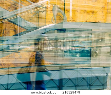 a person's reflection in the building of big-city life
