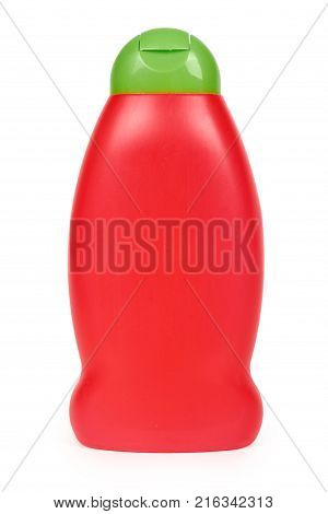 Red plastic bottle for shampoo isolated on white background. Hydiene and cleaning idea.