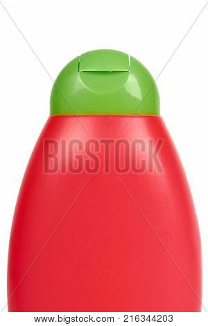 Red plastic bottle for shampoo isolated on white background. Hydiene and cleaning idea.