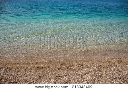 Warm Pebble Beach On The Adriatic Coast.