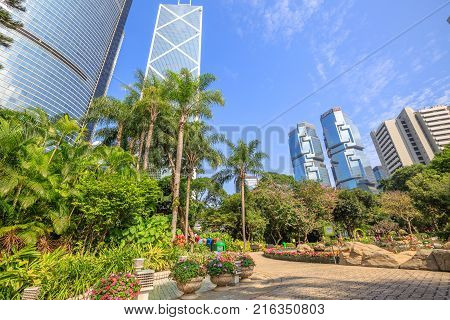 Hong Kong, China - December 7, 2016: Cityscape of Bank of China and Lippo Centre in central business district in a sunny day seen from the Hong Kong Park, an oasis of peace in Hong Kong island.