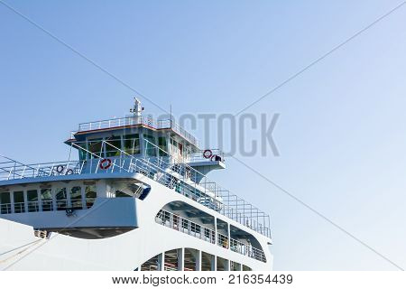 Outdoor view on captain's cabin control room with reflection on windows.