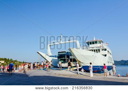 Pefki Island Evia Greece - 11 July 2017: Anchored large ferryboat has opened his front entrance for unloading vehicles at the local harbor