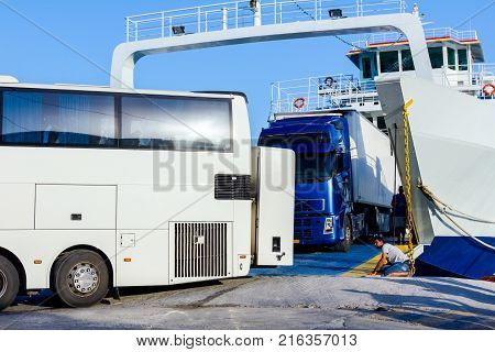 Pefki Island Evia Greece - 11 July 2017: Anchored large ferryboat has opened his front entrance for unloading vehicles at the local harbor