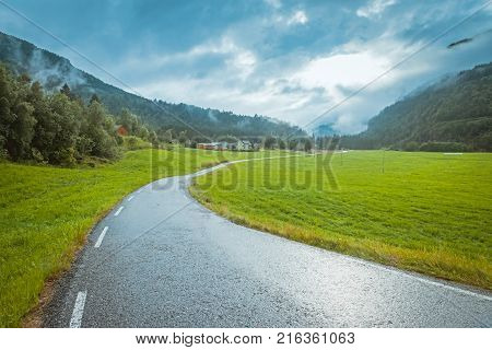 Norway countyside summer road background after rain