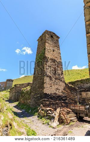 View of the Ushguli village at the foot of Mt. Shkhara. Picturesque and gorgeous scene. Rock tower towers and old houses in Ushguli