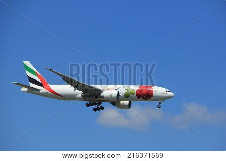 Amsterdam the Netherlands - July 9th 2017: A6-EFL Emirates Boeing 777 approaching Schiphol Amsterdam Airport Kaagbaan runway Red Rose livery