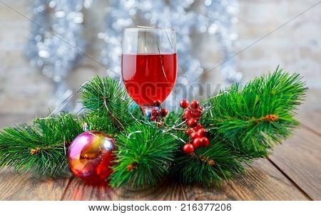 Glasses Of Red Wine In Front Of Christmas Tree For The Holidays