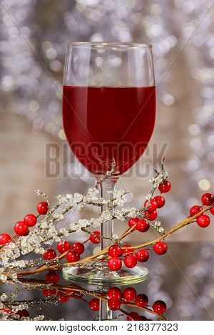 Glasses Of Red Wine In Front Of Christmas Tree For The Holidays