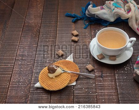 Green tea and sweet dessert from wafers nougat and chocolate cream for a delicious snack.
