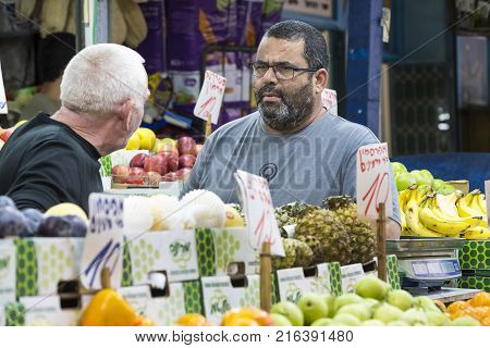 TEL AVIV , ISRAEL - 21 NOVEMBER 2017: Sellers on the old grocery street Nahalat-Benjamin