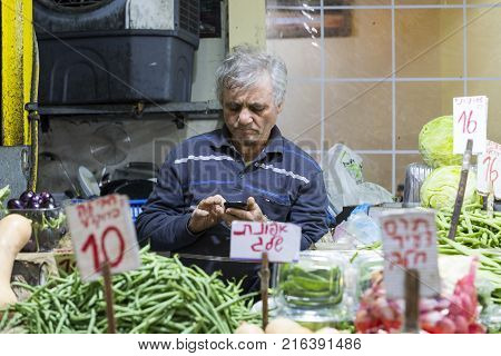 TEL AVIV , ISRAEL - 21 NOVEMBER 2017: Sellers on the old grocery street Nahalat-Benjamin
