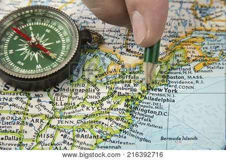 USA map with pencil pointing on various us city.