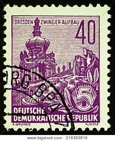 Moscow Russia - December 01 2017: A stamp printed in GDR (East Germany) shows postwar reconstruction of Zwinger in Dresden series 