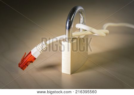 knotted net cable around a padlock. Suitable for concepts as US Government net neutrality regulations, Internet Freedom Preservation Act , Open Internet order.