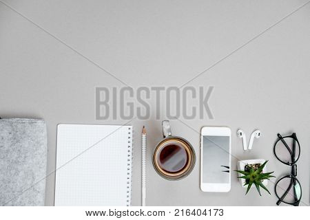 Woman Hands With Laptop, Spectacles And Coffee Cup On Brown Office Desk. Top View. Flat Lay