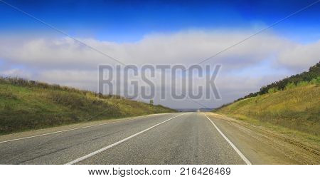 Highway landscape with moving cars at daytime