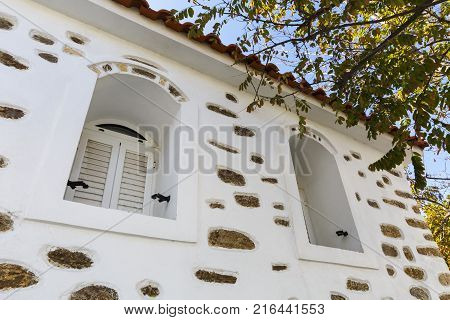 House with a decorative stonework in Psara village.