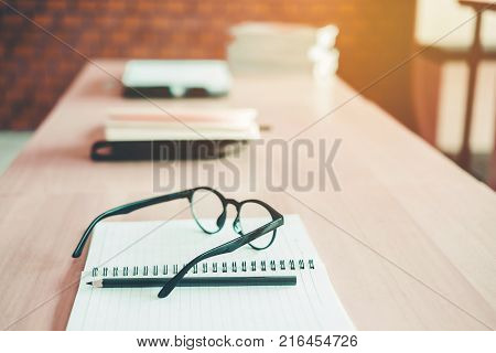 Eye Glasses On The Study Table Education Concept