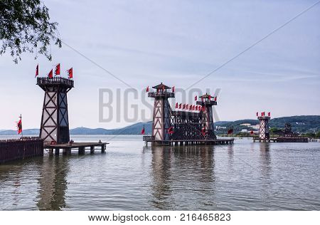 The three kingdoms scenic area walkway and towers in the Wuxi China on Tai lake or taihu in Jiangsu province.