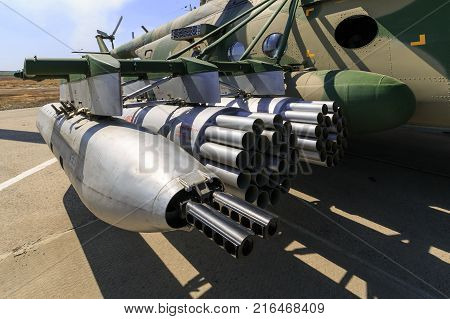 KADAMOVSKIY TRAINING GROUND ROSTOV REGION RUSSIA 26 AUGUST 2017: International military technical forum «ARMY-2017». Hanging gun and launch devices for uncontrolled missiles mounted on military helicopter MI-8AMTSH