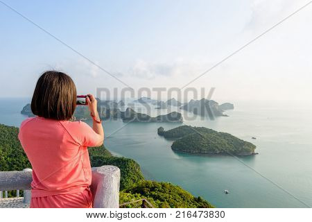 Woman Tourist On Peak Viewpoint Of Island