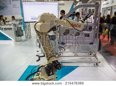 Bangkok Thailand - November 22 2017: Robot arm demonstrate spot welding car door in Metalex 2017