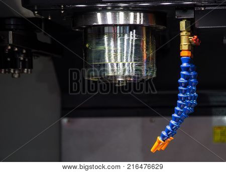 Chuck and coolant nozzle on CNC milling machine