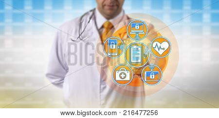 Unrecognizable doctor synchronizing patient medical records across portable devices. Healthcare concept for health information technology electronic medical records practice management system.