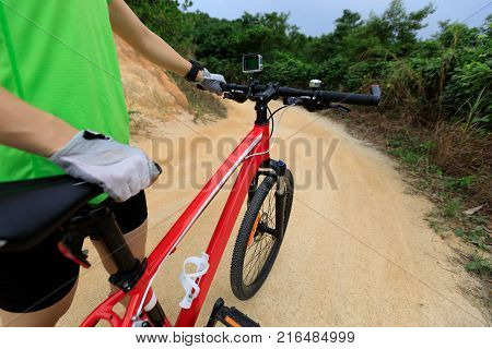 one cyclist cycling mountain bike on trail