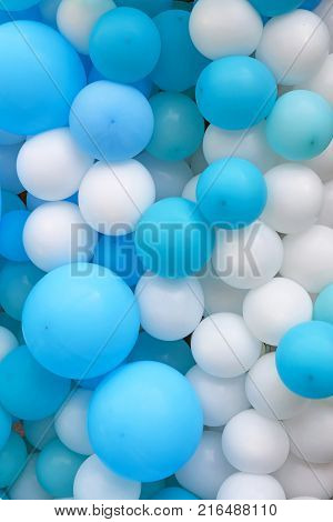 Close up festive background of blue and white air balloons of different sizes
