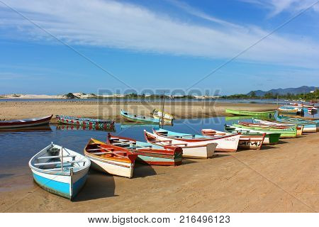 GUARDA DO EMBAU, SANTA CATARINA, BRAZIL - MARCH 19, 2009: Colorful boats docked in the river, near the mouth to the sea. They are used to cross to the beach of Guarda do Embau.